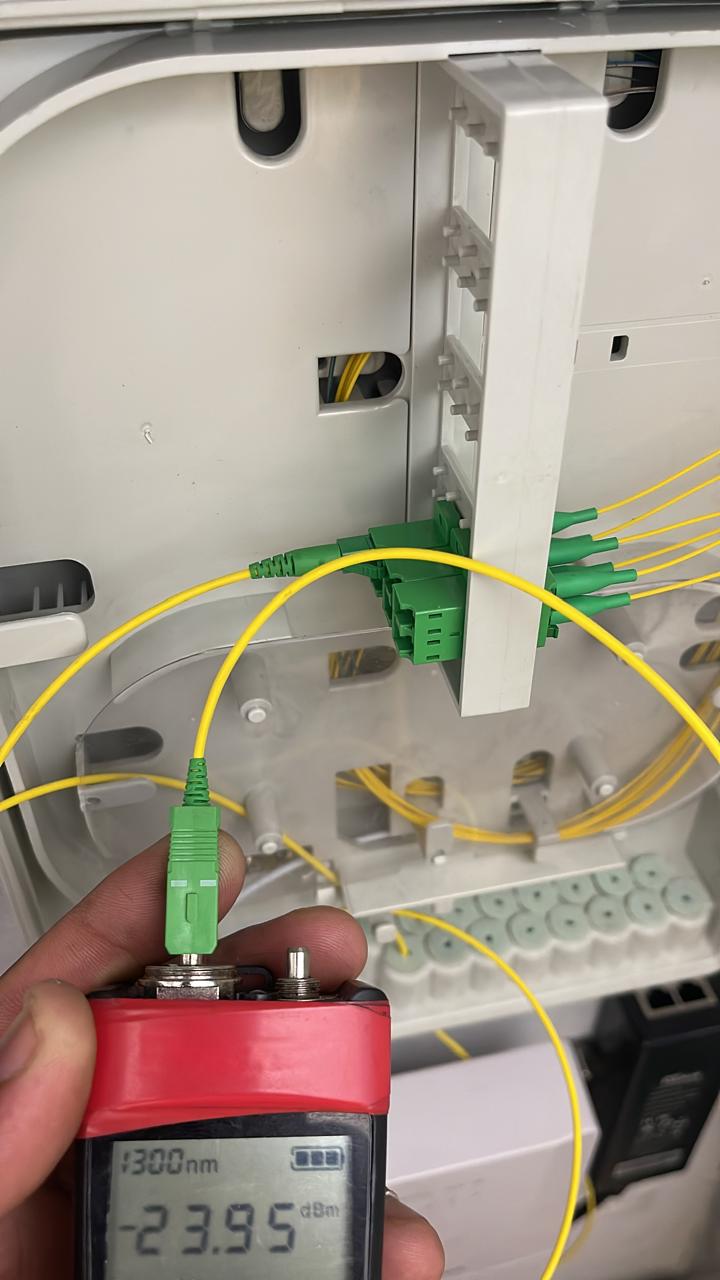 Fiber optic power testing showing 23.95 dBm at 1300nm